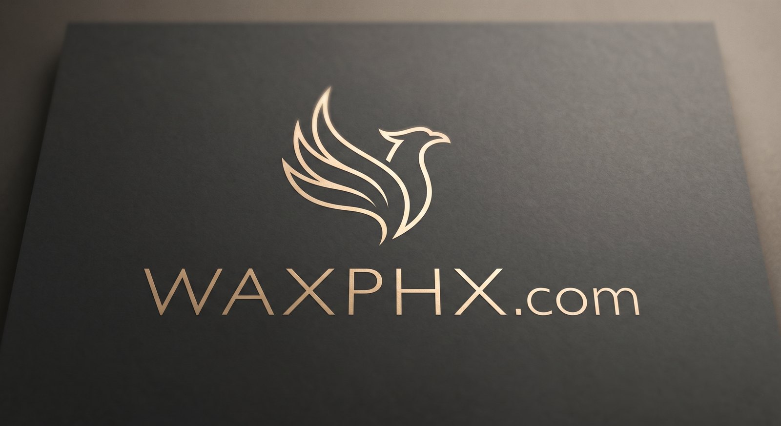 Charcoal card with a gold phoenix mark and the wordmark WAXPHX.com